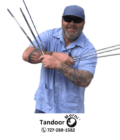 Posing with a domestic Tandoori Skewer for sale and a BBQ at home and after purchasing Home BBQ Tandoor Skewer | Domestic Tandoori Skewer for Sale from Tandoor Morni, the man is satisfied.