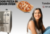 Captivated girl admires freshly baked Tandoori Pizza emerging from traditional Tandoor Oven.